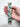 Floral fabric key fob with a dapple dachshund pattern, shown held in a hand to demonstrate size.