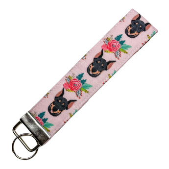 Pink floral Doberman Pinscher key fob with silver metal hardware.