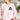 English Setter sweatshirt in light pink modeled by a woman sitting on a couch in her living room.
